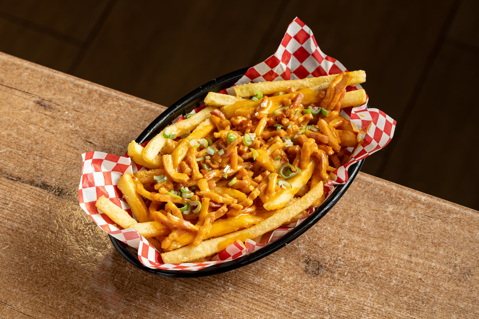 Patatas fritas con cheddar y bacon